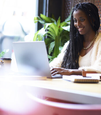 Cheerful,Young,Afro,American,Hipster,Girl,Having,Internet,Conversation,Through